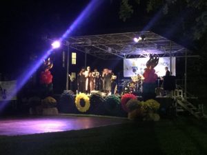 live rock and roll performance at night at Homecoming block party
