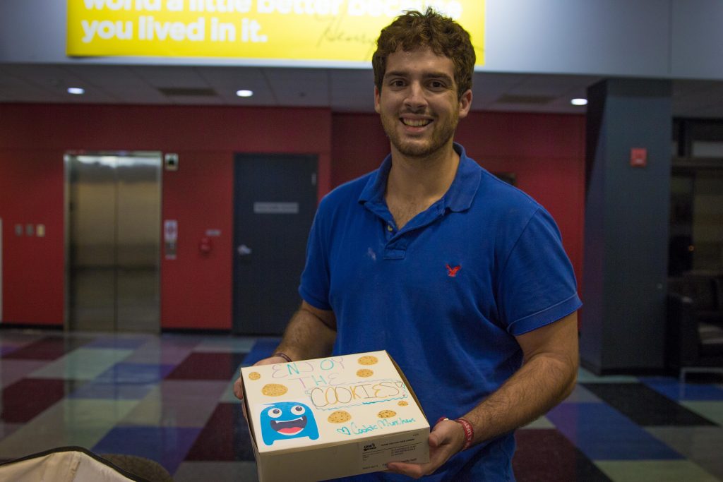 Brandon Lucante delivers fresh cookies in a hand decorated box