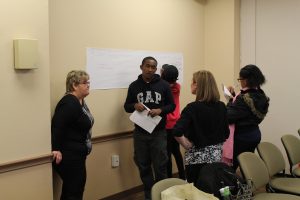 Student ask staff members about financial aid