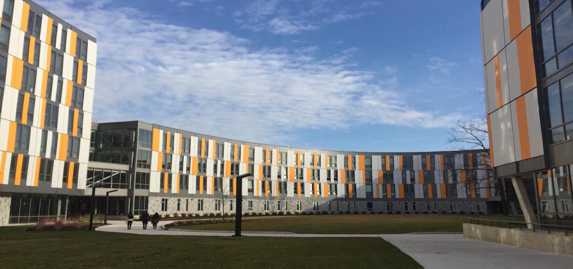 exterior of Holly Pointe Commons, orange, white and gray modern
