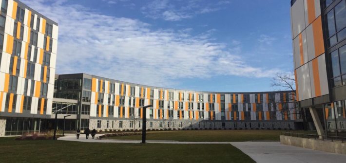 exterior of Holly Pointe Commons, orange, white and gray modern