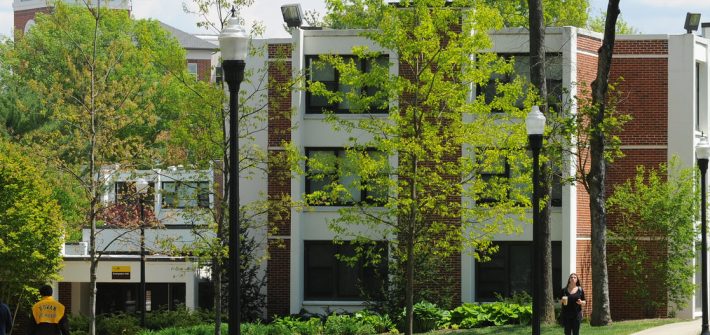 Evergreen Hall through trees
