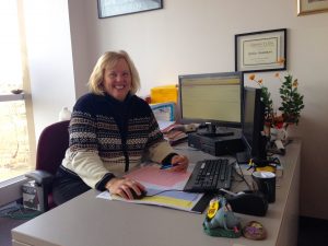 Academic advisor Esther Mummert sits at her desk in the Advising Center.