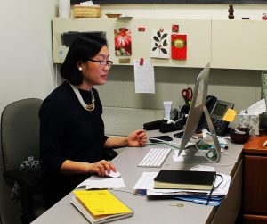 Dr. Li Yang works at her desk in the Rowan's International Center