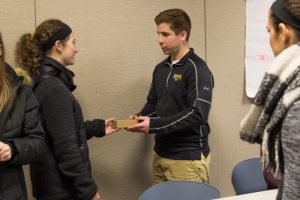 two students at club meeting