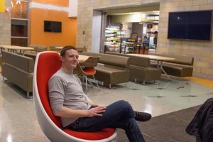 student sits in new engineering building