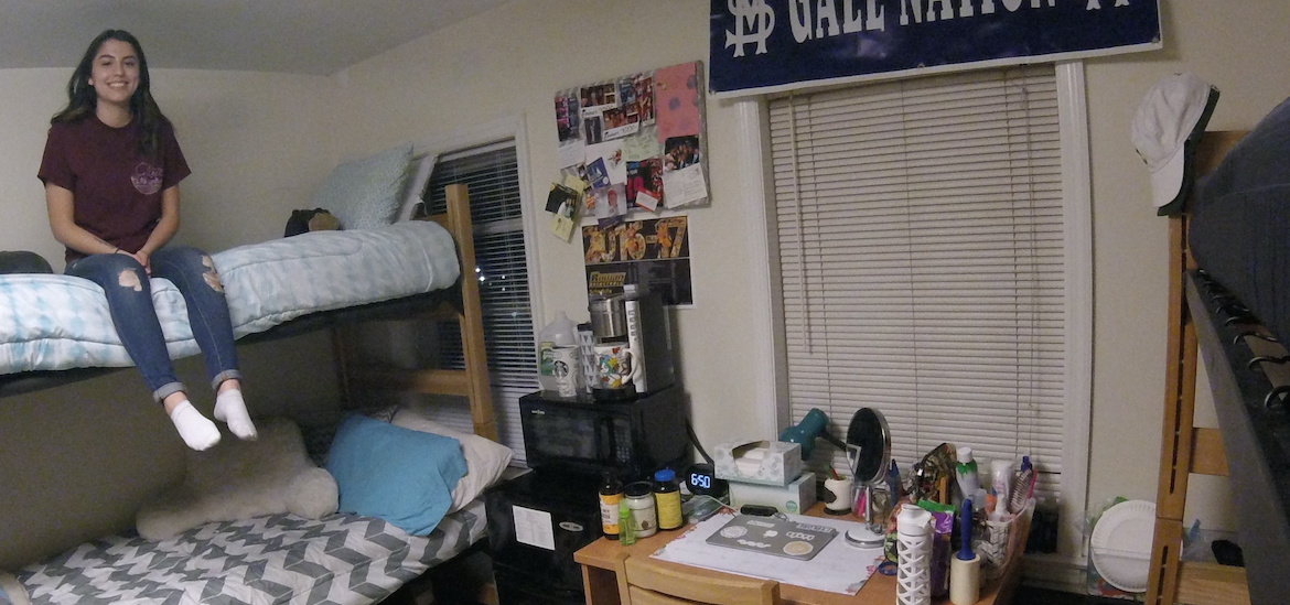 student in dorm room