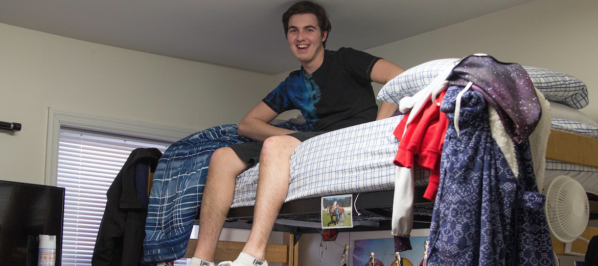 student in laurel hall dorm room