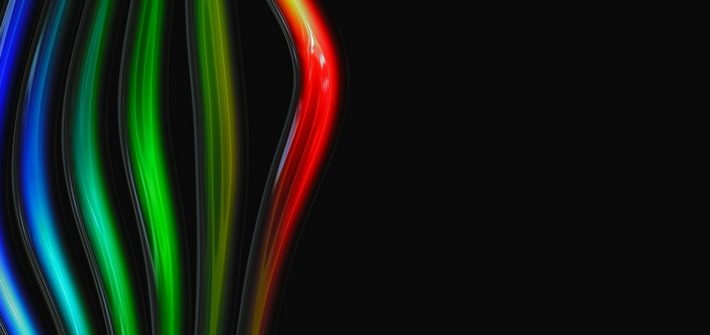 rainbow of light against black background