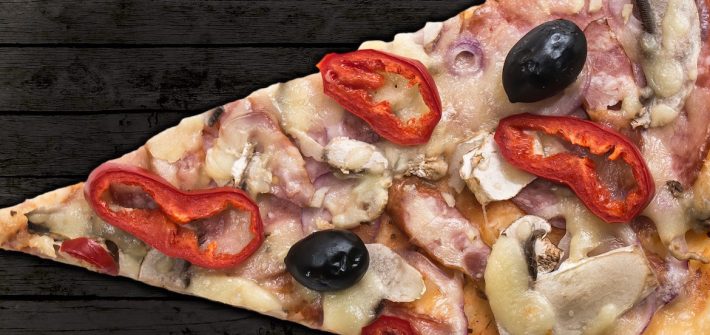 close up of a slice of pizza