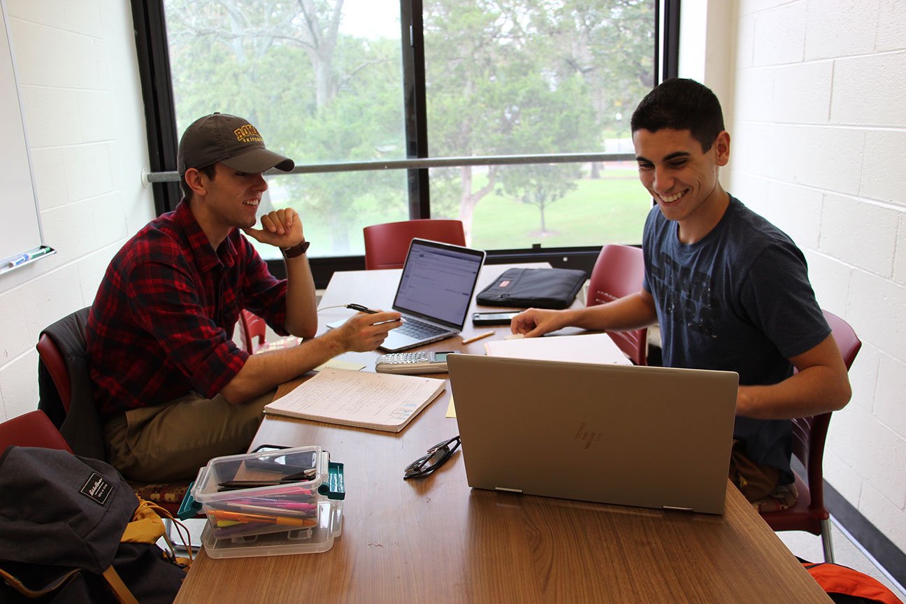 John Martinez (left) and Justin Tavares (right) study in one of Evergreen Hall's study rooms.