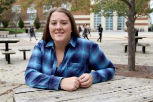 Maribeth at a table outside