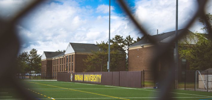 Rowan University sign on turf field outside Rec Center