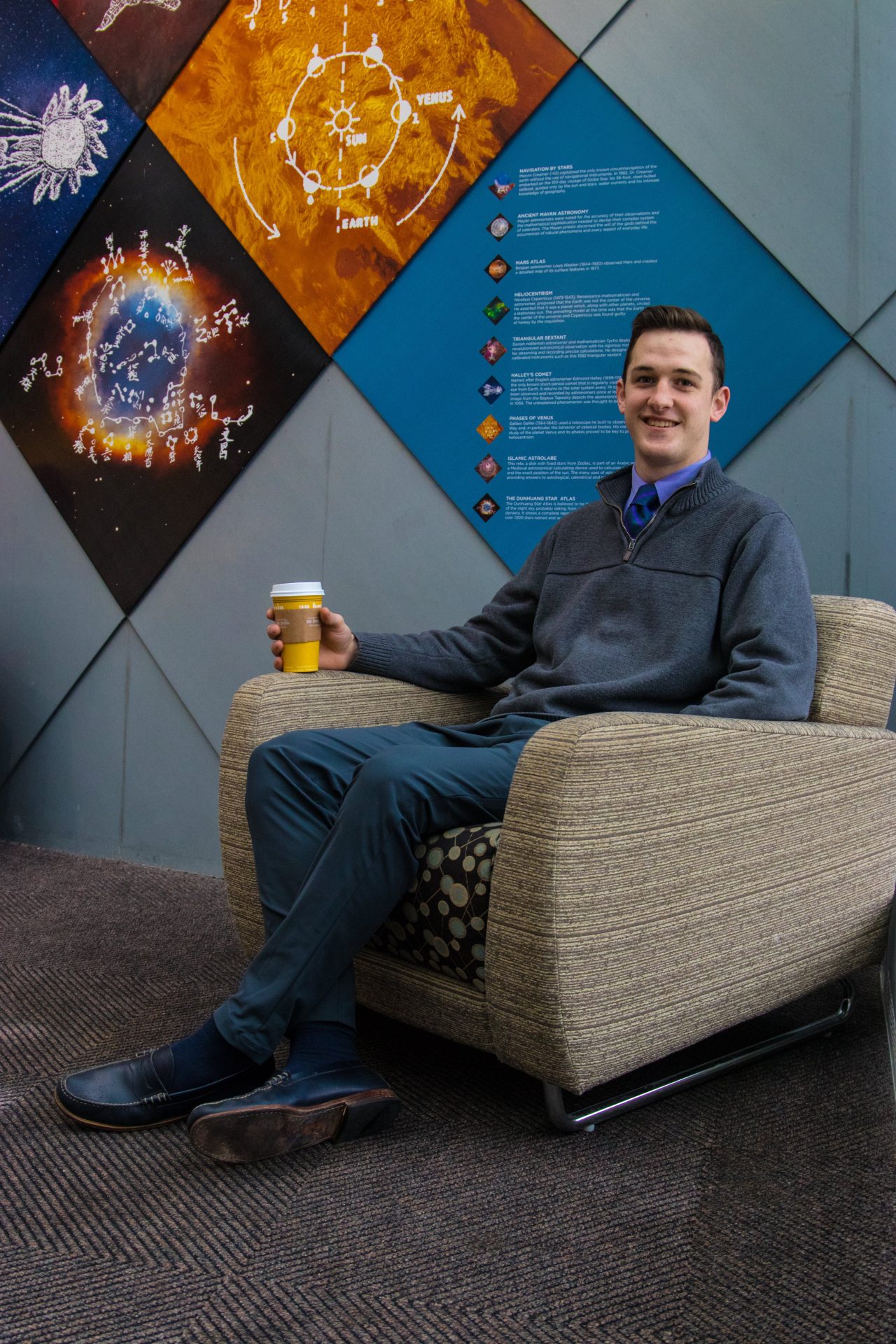 Andrew, a Translational Biomedical Sciences major at Rowan University, drinks Peet's coffee inside the Science Hall lobby.