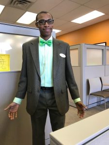 Davon at H&R Block working in his suit