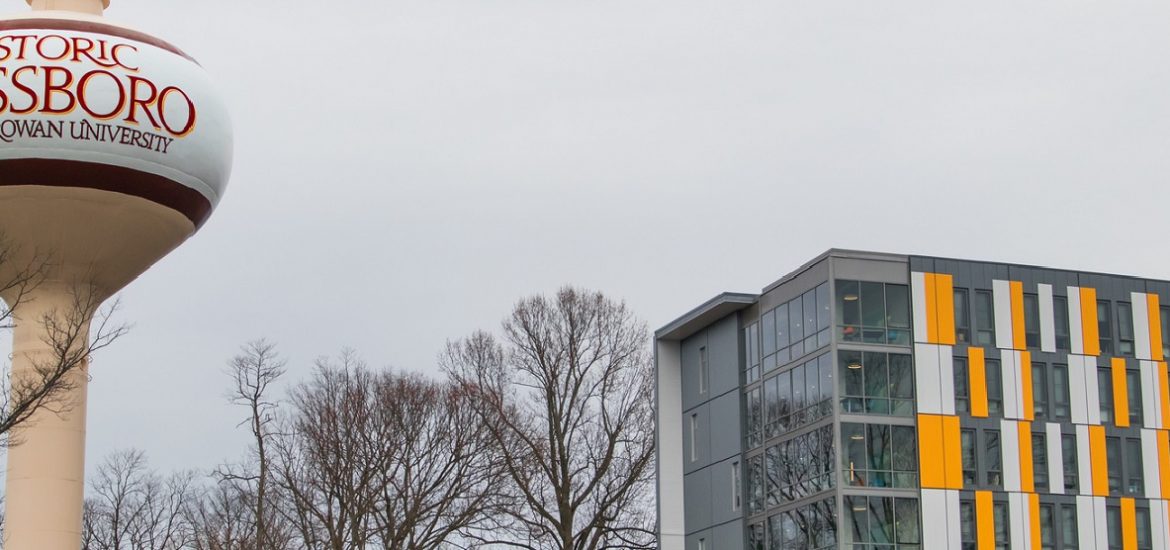 orange gray and white Holly Pointe Commons at Rowan University with Glassboro water tower in view