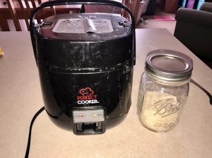 A rice cooker and rice in a residence hall
