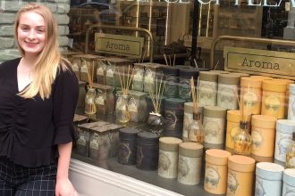 Nicole stands in front of the window front of NYC's Sabon for her Rowan University internship