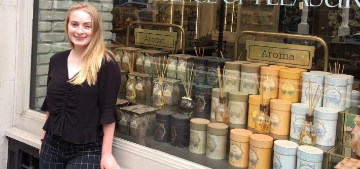 Nicole stands in front of the window front of NYC's Sabon for her Rowan University internship