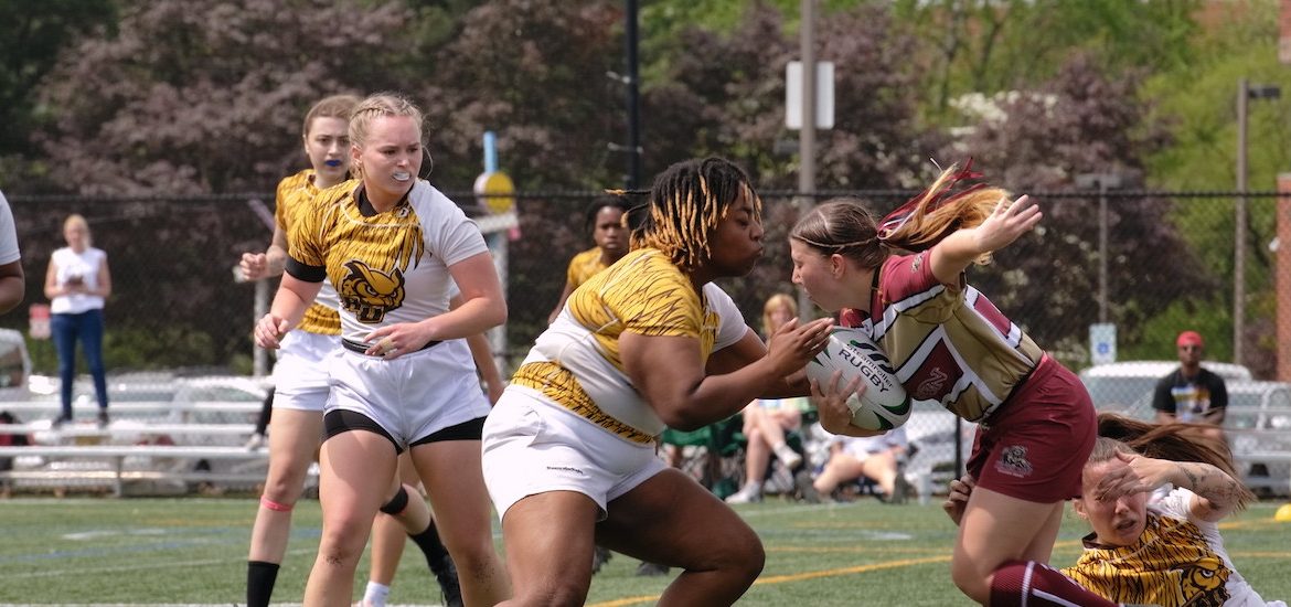Rowan University Rugby during a match, in action defending a ball from the other team.