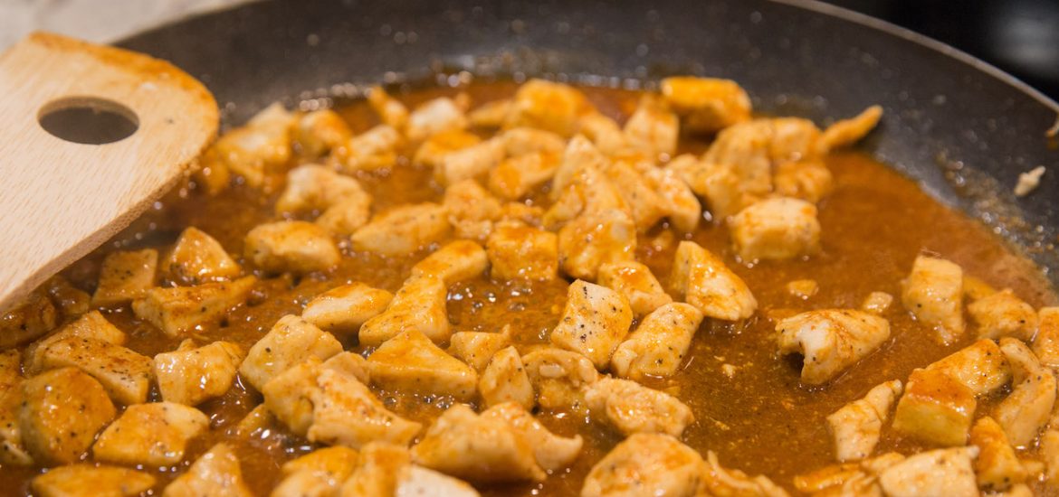 chicken cooking in pan