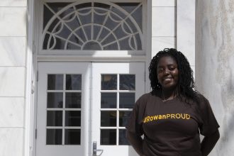 Edris, a rowan university transfer student, outside bunce hall