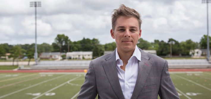 Professor Emil Steiner standing outside Rowan Universitys football stadium