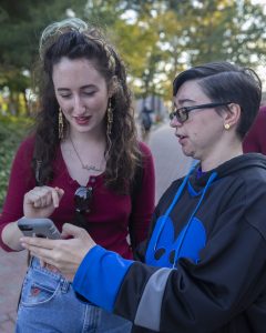 Alyssa Indriso, right, shows Paisley Blair, left, how to work the Pokémon map.