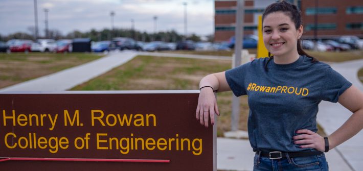 Kelly outside Rowan College of Engineering sign outside