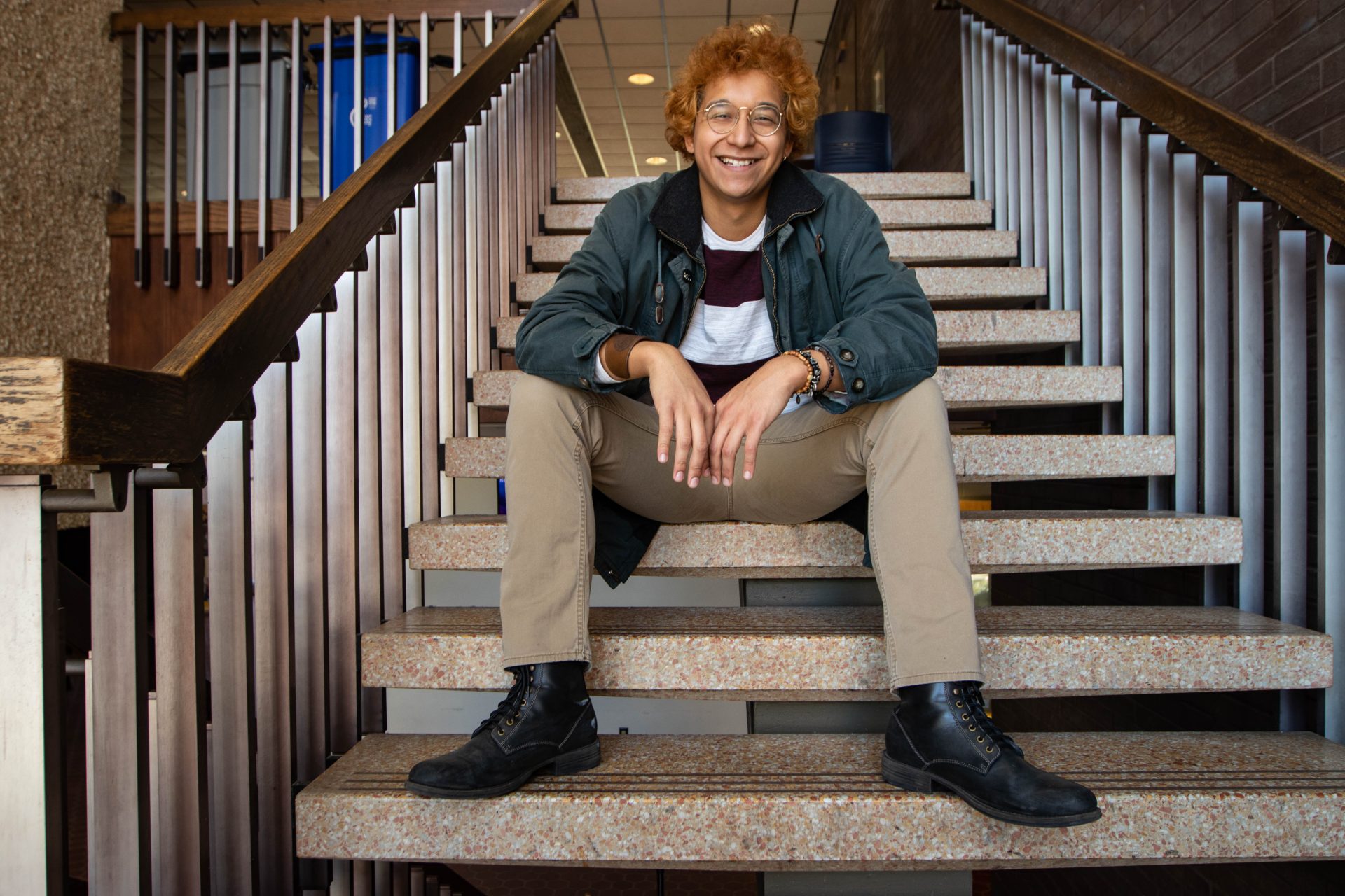 Luis posing on the steps on Wilson Hall.