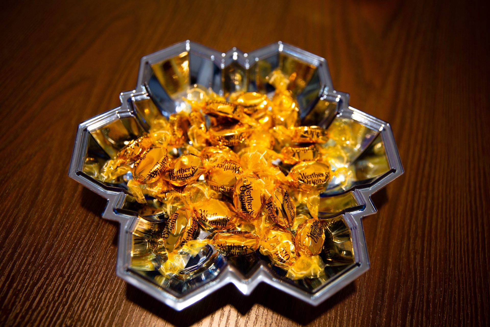 Photo shows a snowflake tray full of caramel candies.