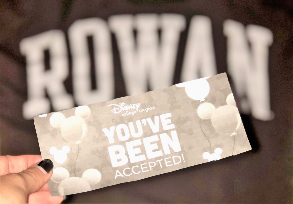 A Rowan tshirt next to the acceptance letter for the disney college program