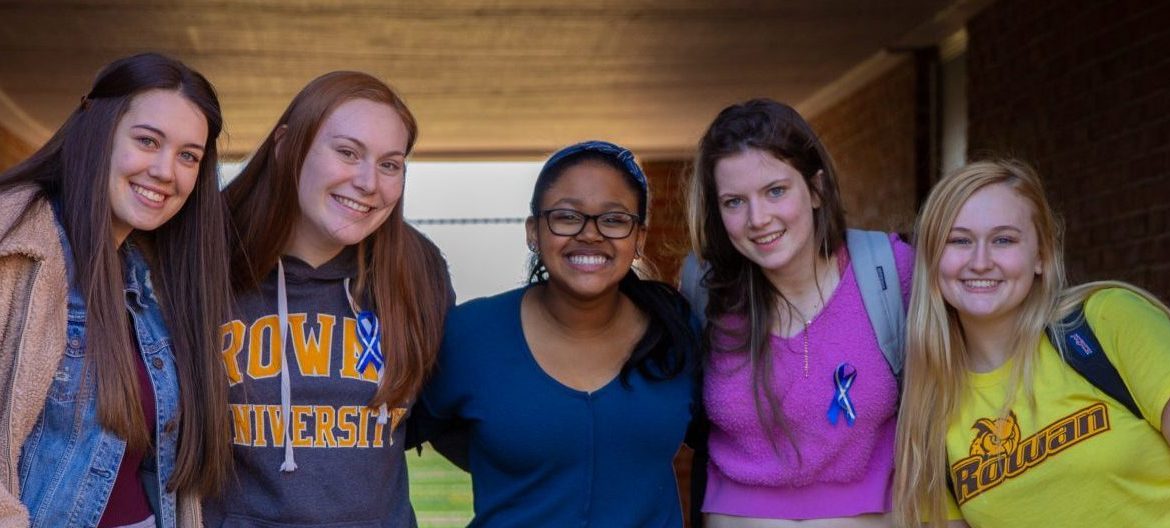 Hajah and four friends stand in the underpass at Willow Hall.