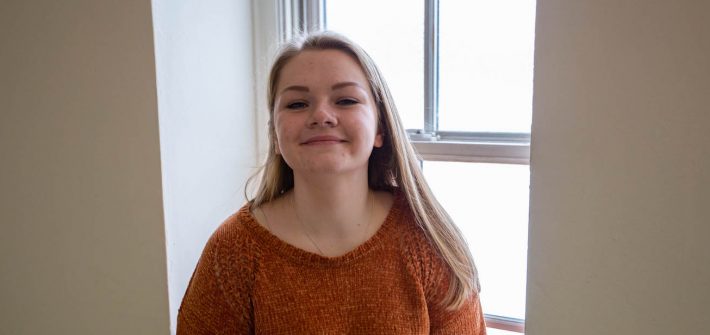 Cassidy sitting in front of window inside Rowan
