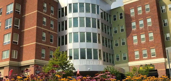 outside of Whitney Center with flowers