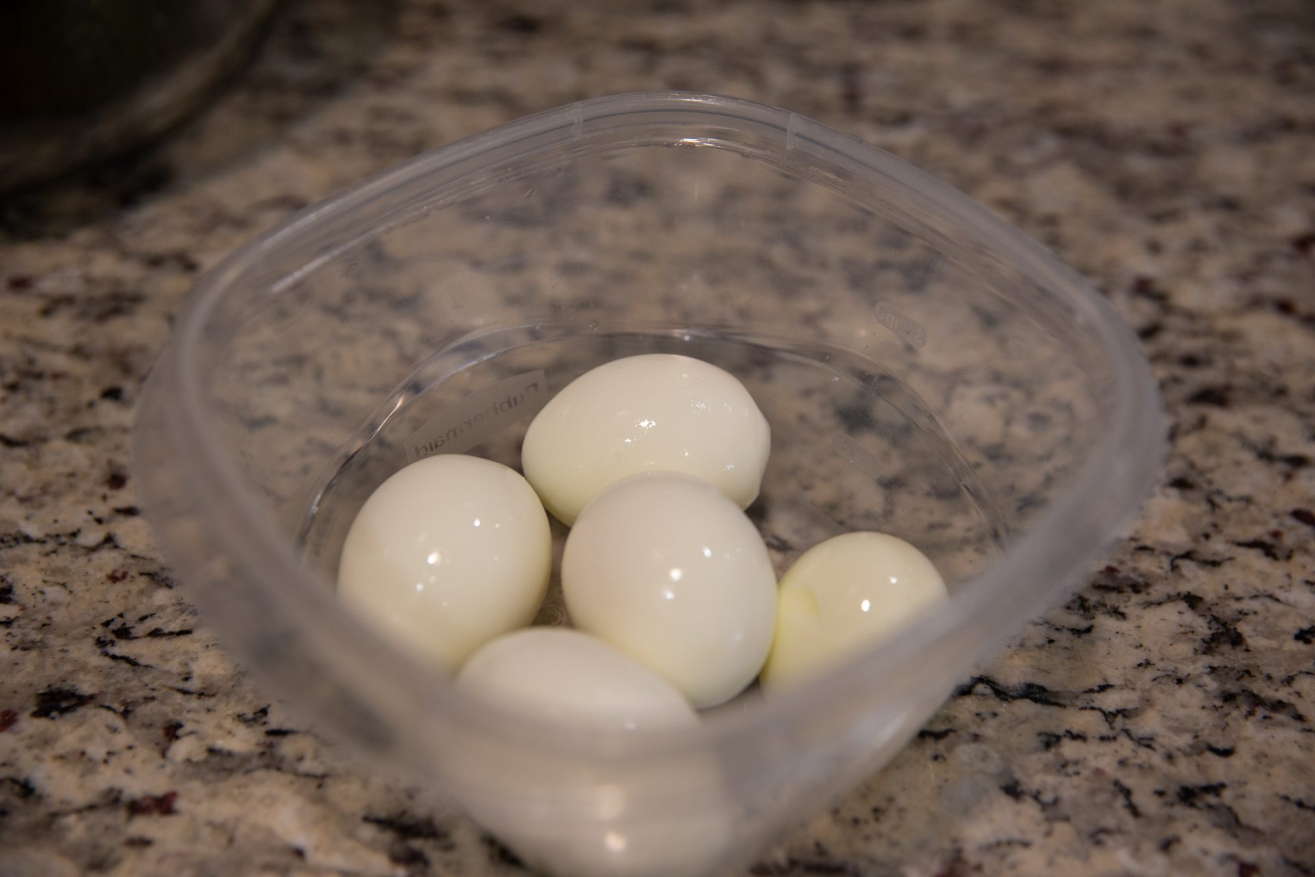 Hard boiled eggs in container.