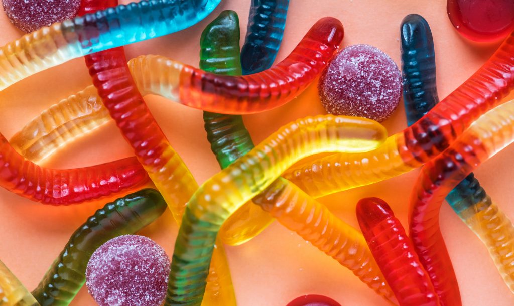 a close up shot of a bunch of gummy worms