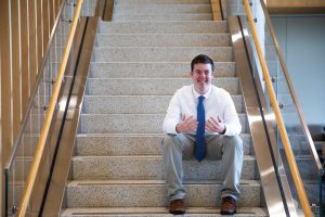 Rowan political science major Jason Brooks on the steps of Business Hall