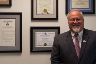 Rowan alumnus Brian W. Jones at the First National Bank of Elmer, where he is President and CEO