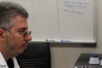 Gaspare Carollo, a biophysics major from Marlton, NJ, conducts research at his summer research internship at Rowan.