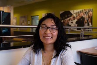 Bioinformatics major Anne Marie Fernandez photographed inside Chamberlain Student Center