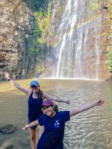 Alyssa in Israel standing in front of a waterfall with a friend