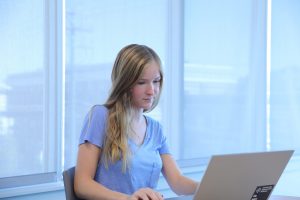 Marketing and Supply Chain & Logistics major Erin DeBiasse works on a computer