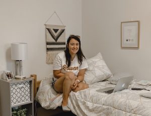 PR major and transfer student Jenna Fischer inside her dorm room
