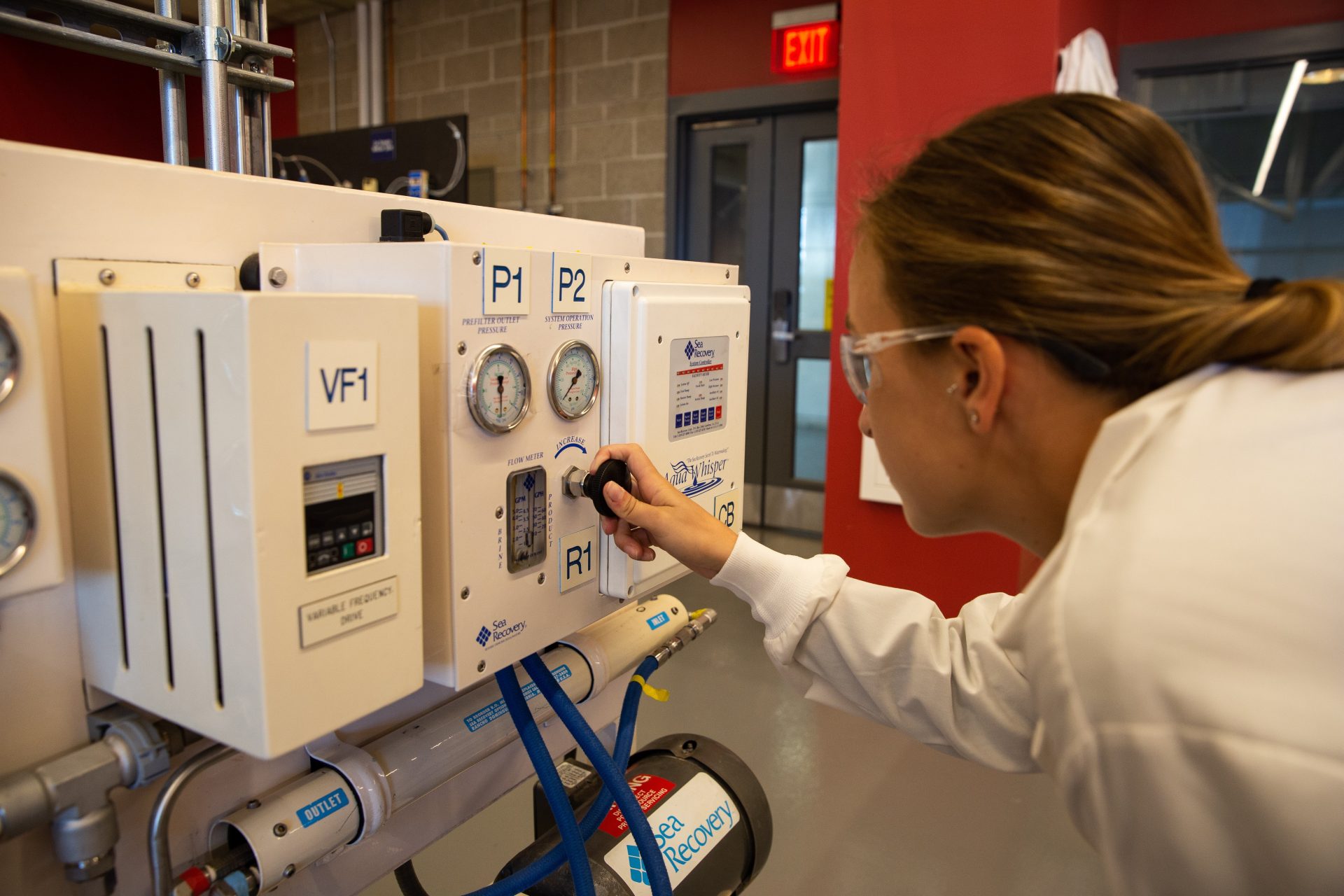 Rowan Chemical Engineering major Casey Wagner works in an engineering lab.