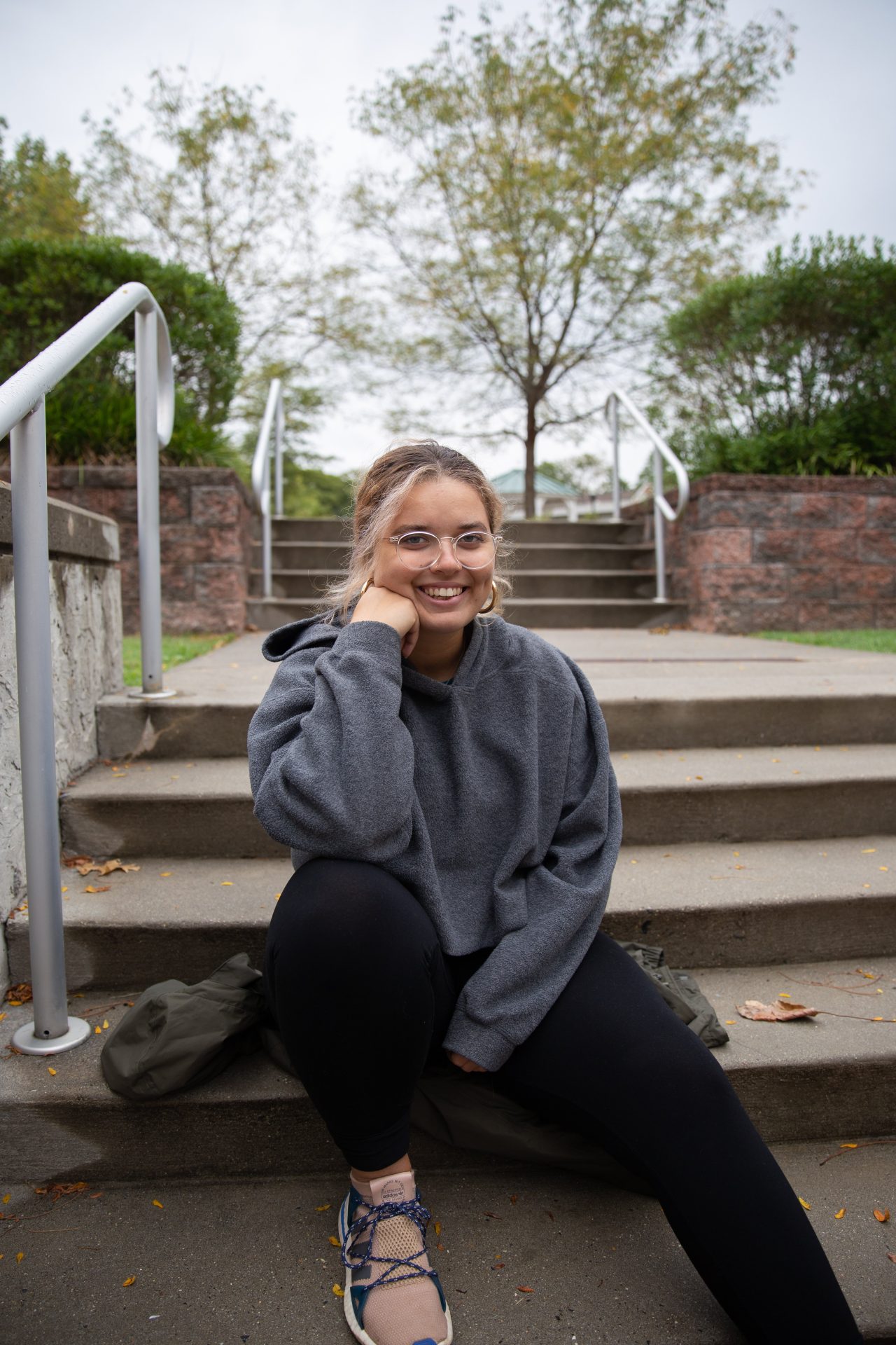 Autumn Bowman sits outside of Bunce Hall.