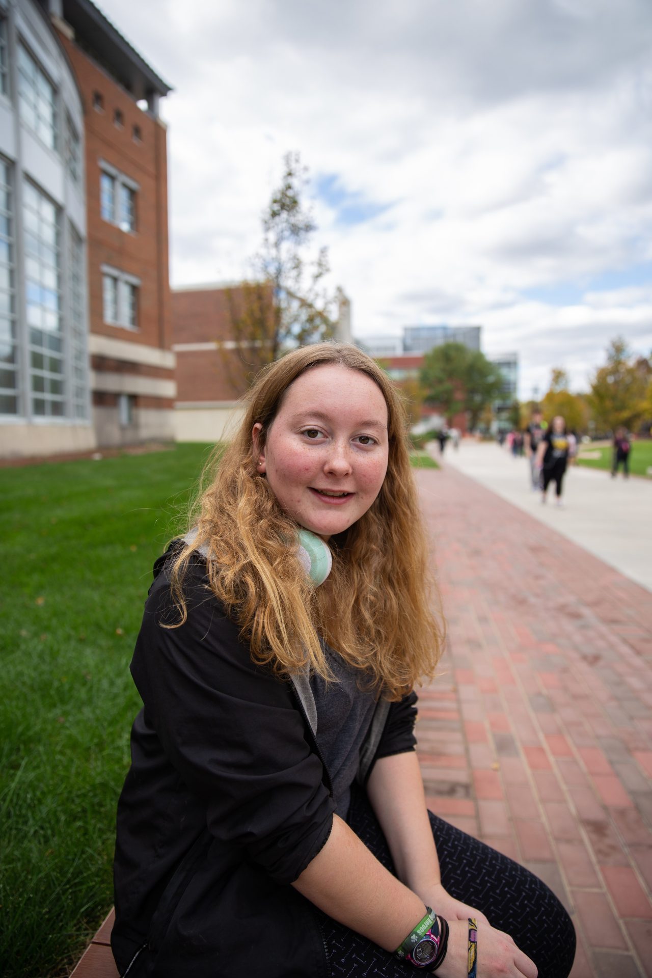 Freshman Public Relations major Rachel Rumsby sits outside on Rowan's campus. 