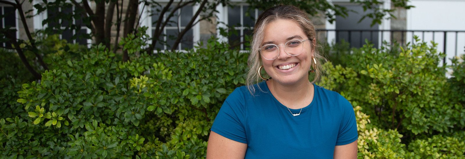 Communication Studies major Autumn Bowman sitting on campus