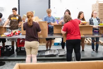 students sorting food at the south jersey food bank
