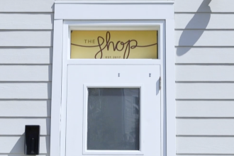 The outside wall of the SHOP building.